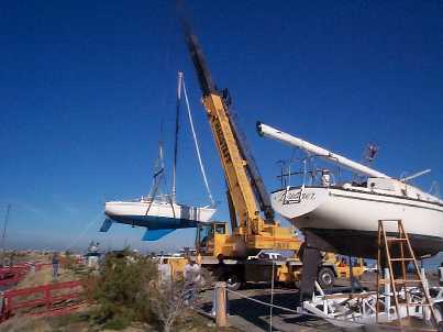 sailboat being craned into the Great Salt Lake