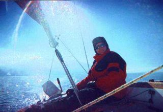 a man sailing in the winter